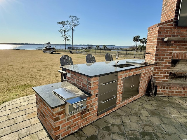 2425 S Bay St, Georgetown, SC 29440 - view of patio / terrace with area for grilling, a water view, and a sink
