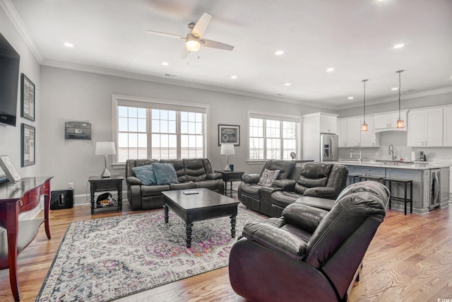 2425 S Bay St, Georgetown, SC 29440 - living room with a ceiling fan, light wood-style floors, recessed lighting, ornamental molding, and baseboards