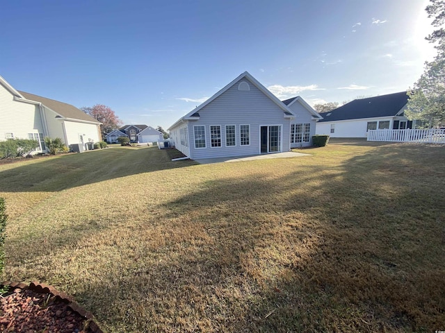 1435 Southwood Dr, Myrtle Beach, SC 29575 - rear view of house with fence and a lawn
