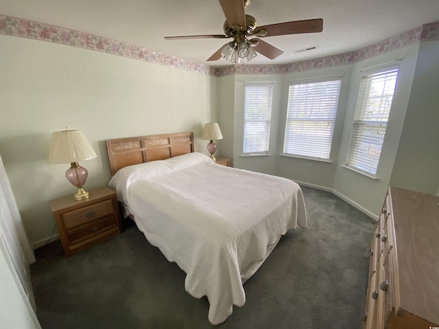 1435 Southwood Dr, Myrtle Beach, SC 29575 - bedroom featuring visible vents, baseboards, dark carpet, and a ceiling fan