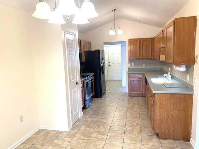 1435 Southwood Dr, Myrtle Beach, SC 29575 - kitchen with vaulted ceiling, a chandelier, range with electric stovetop, brown cabinets, and a sink