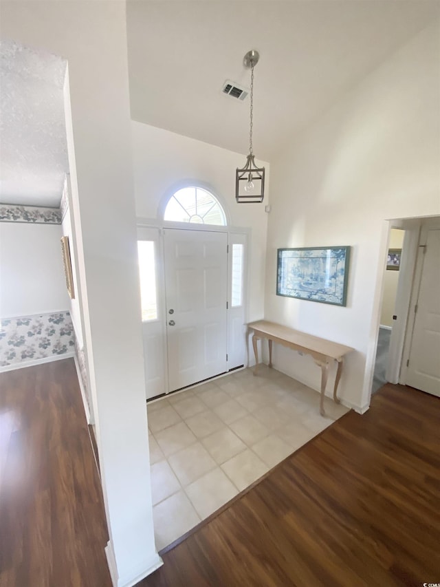 1435 Southwood Dr, Myrtle Beach, SC 29575 - entrance foyer with visible vents, baseboards, vaulted ceiling, and wood finished floors