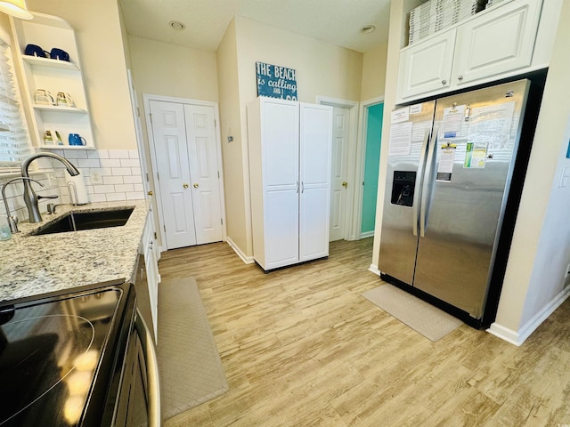6001-G5 S Kings Hwy, Myrtle Beach, SC 29575 - kitchen featuring stainless steel fridge, open shelves, a sink, electric range, and white cabinets