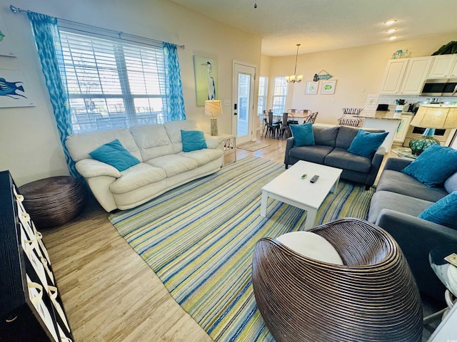 6001-G5 S Kings Hwy, Myrtle Beach, SC 29575 - living room featuring light wood-style flooring and a chandelier