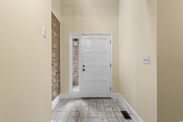 5616 N Kings Hwy, Myrtle Beach, SC 29577 - entryway featuring brick wall and baseboards