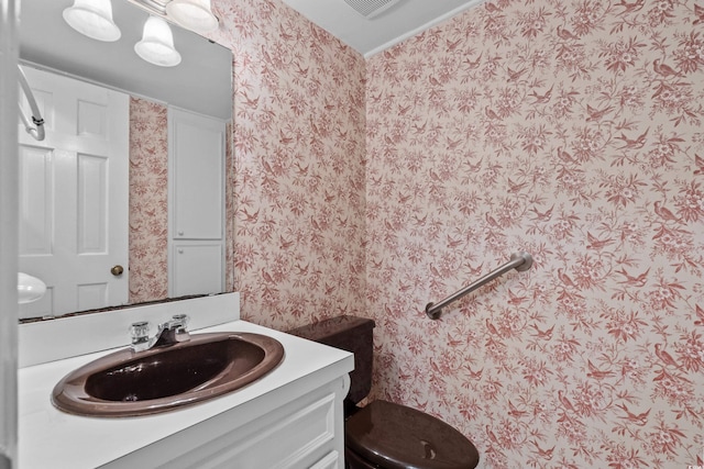 5616 N Kings Hwy, Myrtle Beach, SC 29577 - bathroom with wallpapered walls, vanity, and toilet