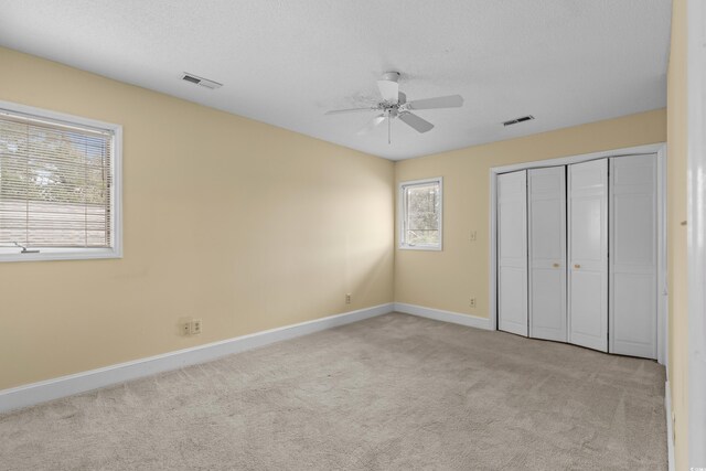 5616 N Kings Hwy, Myrtle Beach, SC 29577 - unfurnished bedroom with carpet flooring, baseboards, a closet, and ceiling fan
