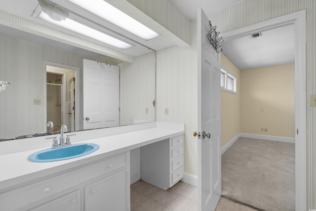 5616 N Kings Hwy, Myrtle Beach, SC 29577 - bathroom featuring vanity, baseboards, tile patterned floors, and wallpapered walls