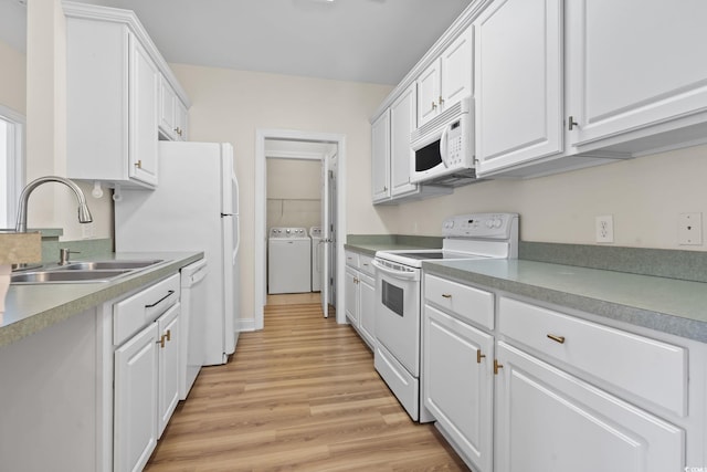 2081 Silvercrest Dr Unit G, Myrtle Beach, SC 29579 - kitchen with white appliances, a sink, washing machine and clothes dryer, white cabinets, and light wood-style floors