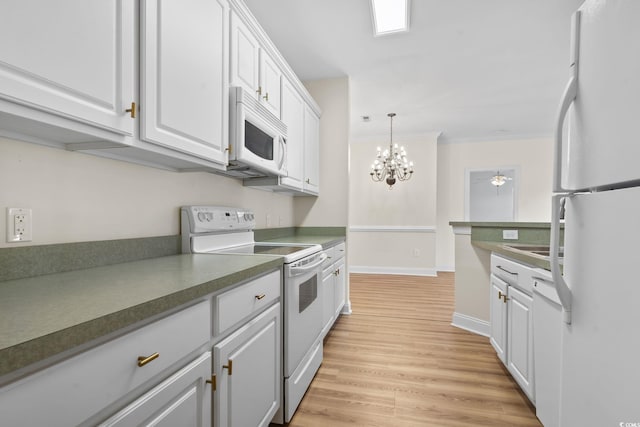 2081 Silvercrest Dr Unit G, Myrtle Beach, SC 29579 - kitchen with white appliances, ornamental molding, white cabinetry, dark countertops, and light wood-style floors