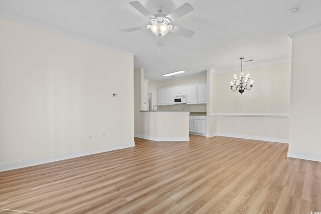 2081 Silvercrest Dr Unit G, Myrtle Beach, SC 29579 - unfurnished living room with ornamental molding, light wood-type flooring, a chandelier, baseboards, and ceiling fan