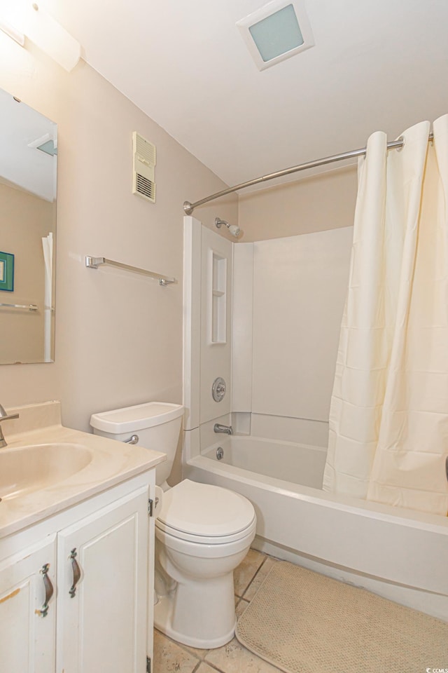 bathroom with shower / bath combo with shower curtain, vanity, toilet, and tile patterned floors