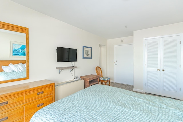 bedroom featuring a closet and baseboards