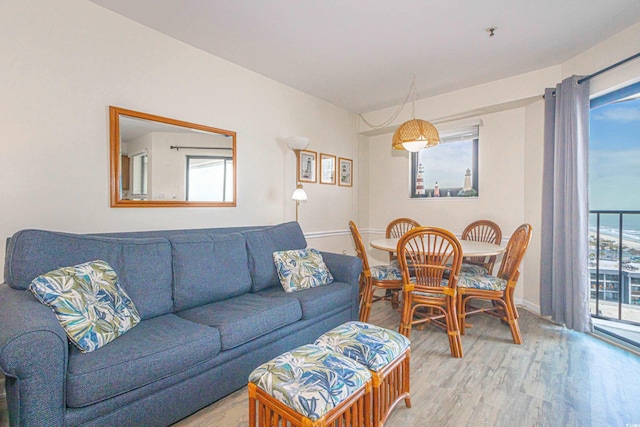 living room featuring light wood-style flooring and baseboards