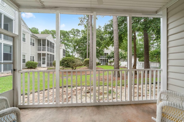 unfurnished sunroom with a residential view