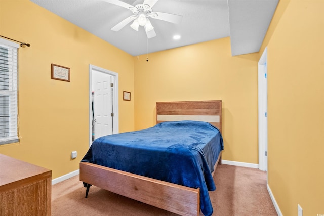 bedroom with baseboards, a ceiling fan, and carpet