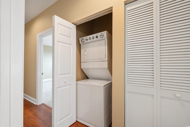 1025 World Tour Blvd Unit 101A, Myrtle Beach, SC 29579 - clothes washing area with stacked washer and clothes dryer, wood finished floors, and baseboards
