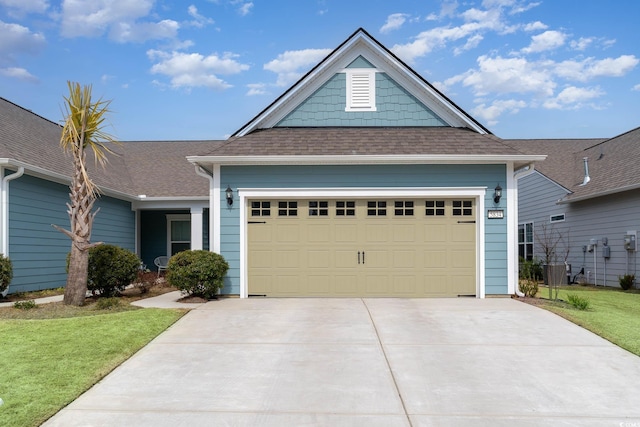5834 Cremona Dr, Myrtle Beach, SC 29577 - view of front of home with driveway, a front yard, roof with shingles, and a garage