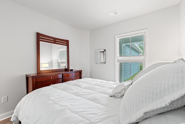 5834 Cremona Dr, Myrtle Beach, SC 29577 - bedroom featuring baseboards and wood finished floors