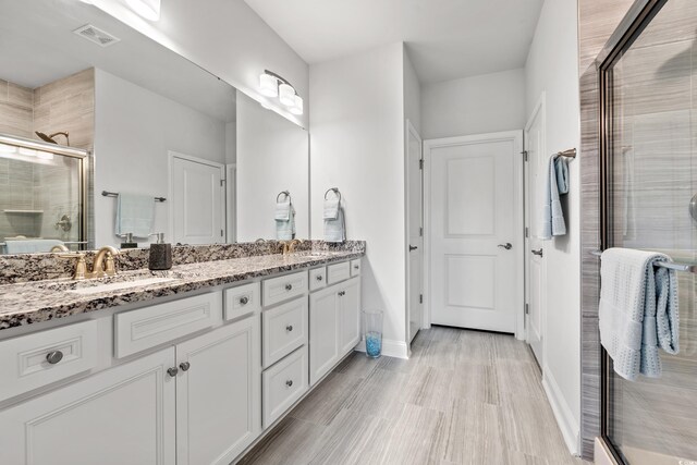 5834 Cremona Dr, Myrtle Beach, SC 29577 - full bath featuring a stall shower, double vanity, and baseboards