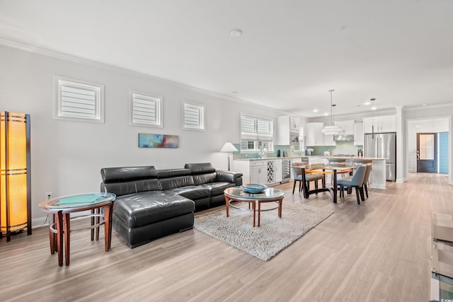 5834 Cremona Dr, Myrtle Beach, SC 29577 - living room with crown molding, light wood-style flooring, recessed lighting, and baseboards