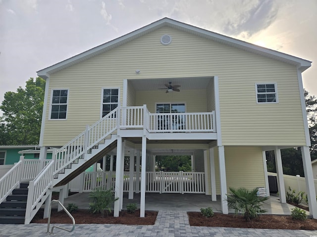 605 15th Ave S, North Myrtle Beach, SC 29582 - back of house with stairs and a ceiling fan