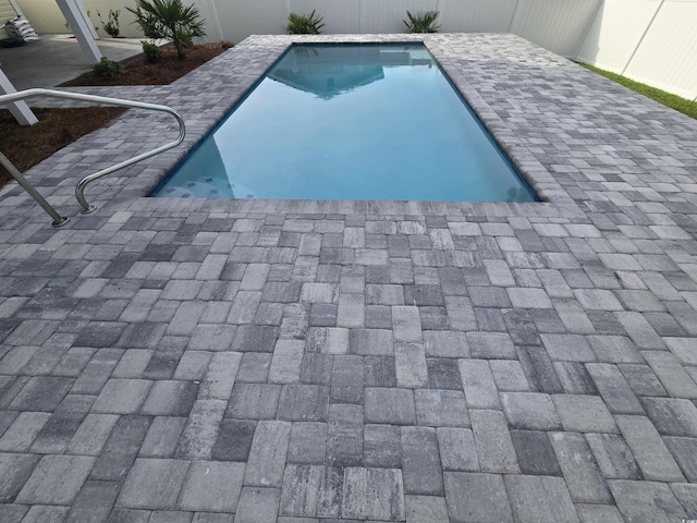 605 15th Ave S, North Myrtle Beach, SC 29582 - view of swimming pool featuring a fenced backyard and a patio