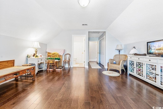 728 Camden Cir, Pawleys Island, SC 29585 - sitting room with vaulted ceiling, wood finished floors, and a textured ceiling