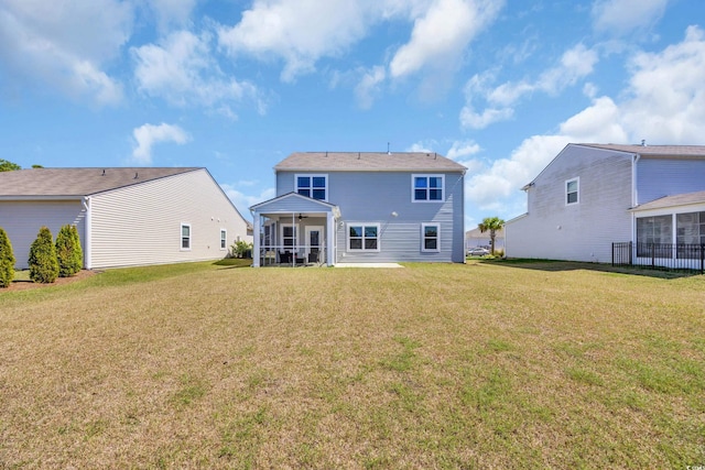 3304 Candytuft Dr, Conway, SC 29526 - rear view of house featuring a sunroom and a lawn