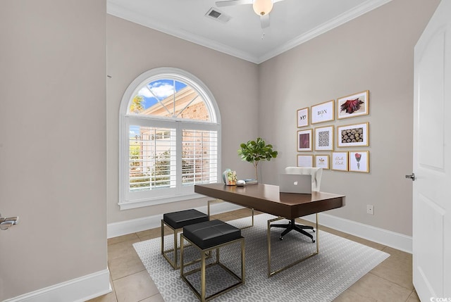 office space with crown molding, visible vents, baseboards, light tile patterned flooring, and a ceiling fan
