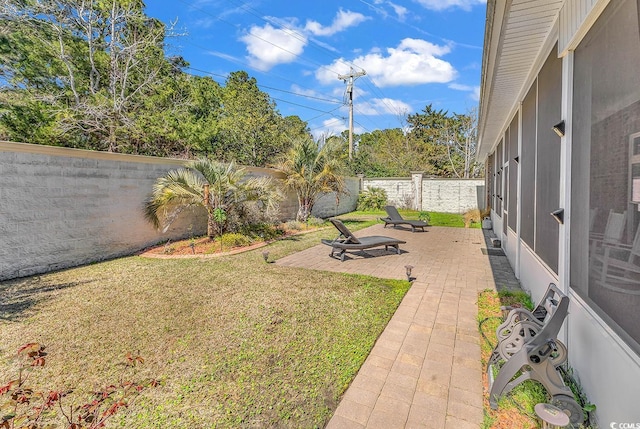 view of yard with a patio and a fenced backyard