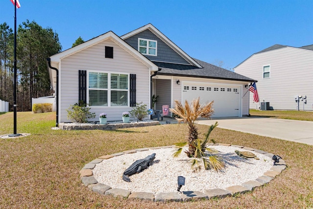 134 Winding Path Dr, Loris, SC 29569 - view of front facade featuring driveway, a garage, a front yard, central AC unit, and a shingled roof