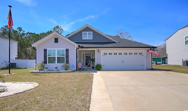 134 Winding Path Dr, Loris, SC 29569 - view of front of home with concrete driveway, cooling unit, a garage, and a shingled roof