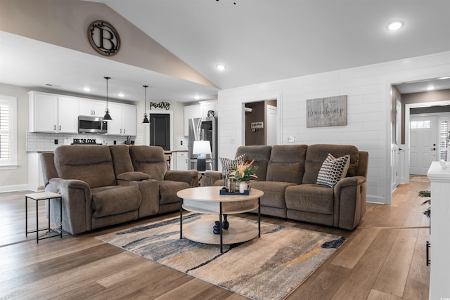 134 Winding Path Dr, Loris, SC 29569 - living room featuring light wood-style floors, vaulted ceiling, and recessed lighting