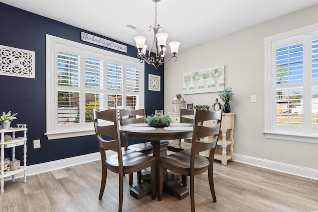 134 Winding Path Dr, Loris, SC 29569 - dining space with a chandelier, plenty of natural light, and wood finished floors