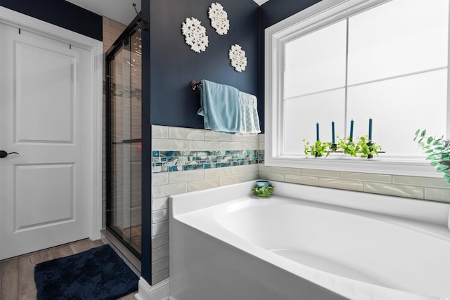 134 Winding Path Dr, Loris, SC 29569 - bathroom featuring a garden tub, a stall shower, and wood finished floors