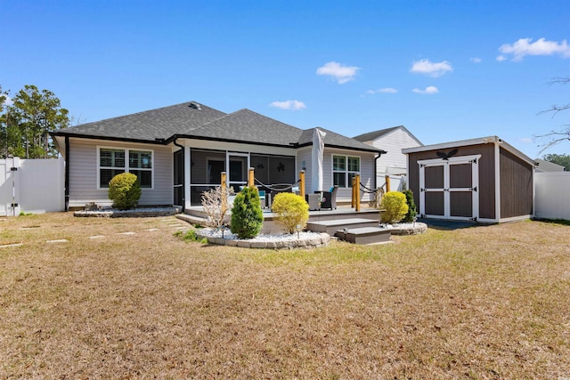 134 Winding Path Dr, Loris, SC 29569 - back of house with a sunroom and roof with shingles
