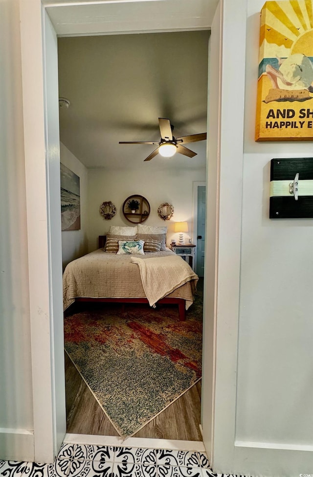 bedroom with wood finished floors and ceiling fan