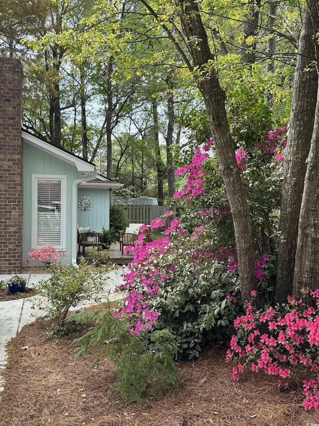 view of yard with fence and a deck