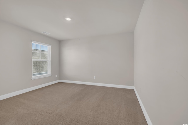empty room with baseboards and carpet floors