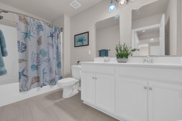 full bathroom with toilet, double vanity, and shower / tub combo with curtain