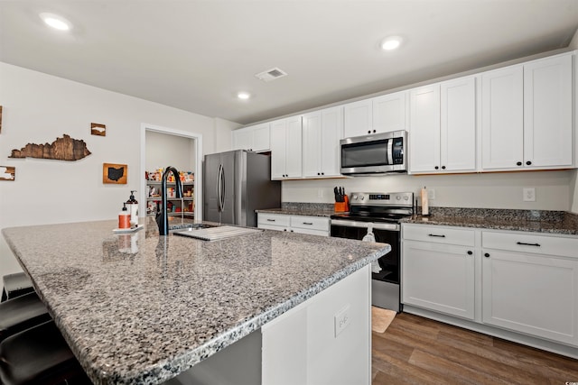380 Harvest Ridge Way, Conway, SC 29527 - kitchen featuring visible vents, dark wood-style flooring, light stone countertops, and stainless steel appliances
