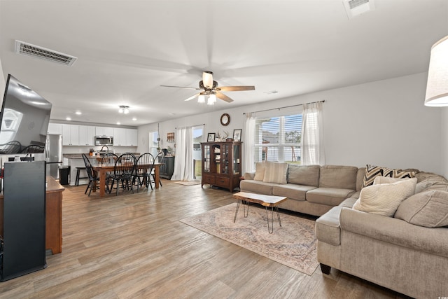 380 Harvest Ridge Way, Conway, SC 29527 - living area featuring visible vents, a ceiling fan, and light wood finished floors