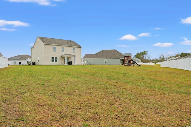 380 Harvest Ridge Way, Conway, SC 29527 - rear view of house featuring a playground, fence, and a yard