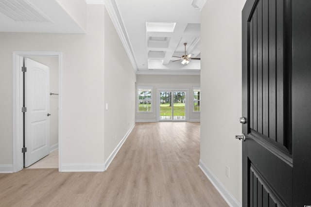 foyer featuring baseboards, light wood-style floors, coffered ceiling, beamed ceiling, and ornamental molding