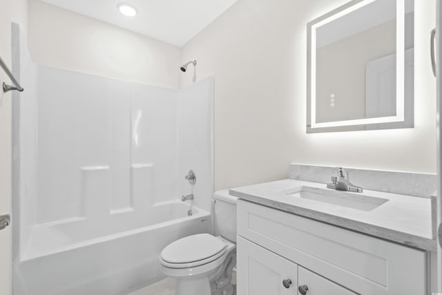 full bathroom featuring toilet, vanity, and shower / tub combination