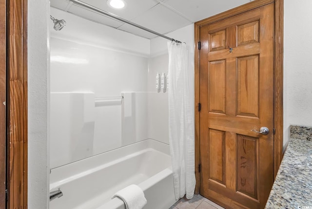 full bathroom with tile patterned floors and shower / bath combo