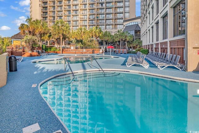 pool with a patio area