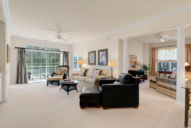 living room featuring light colored carpet, a ceiling fan, and ornate columns