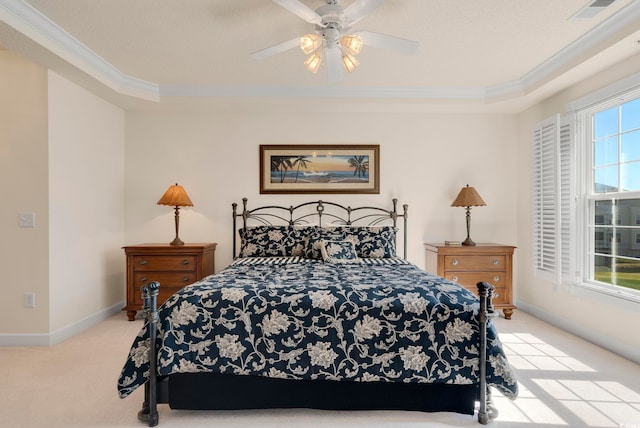 bedroom featuring crown molding, carpet flooring, baseboards, and a ceiling fan